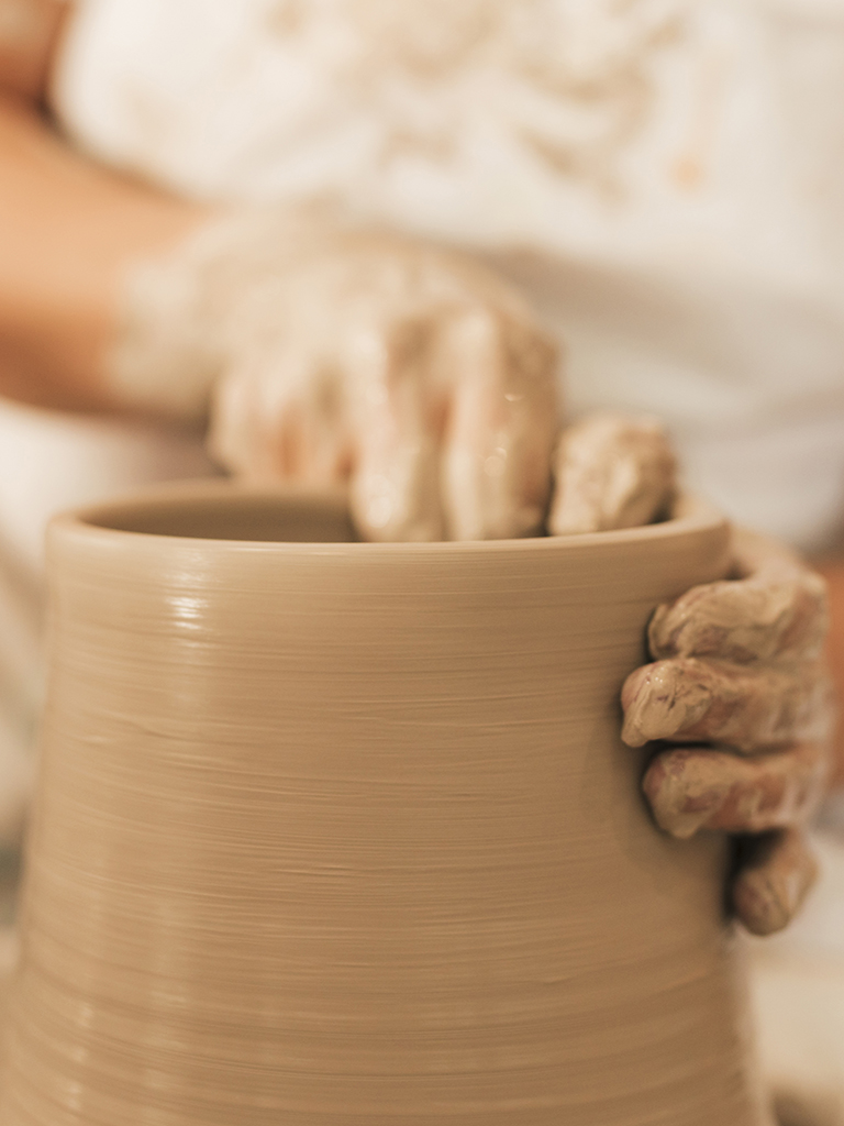 female-potter-working-pottery-wheel